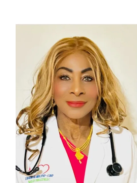 Professional woman with blonde hair and white coat.